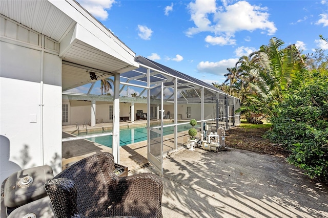 view of pool with a patio and a lanai