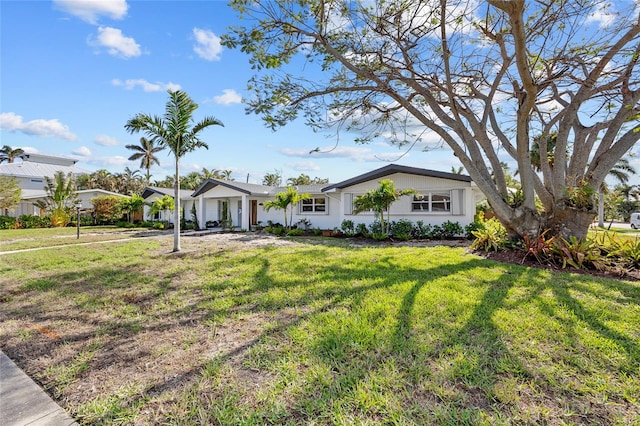 single story home with a front lawn