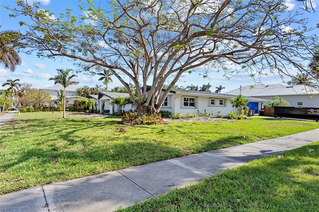 view of front of home with a front lawn