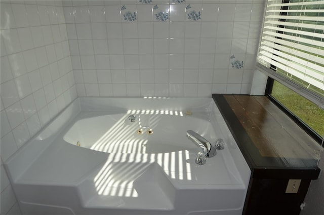 bathroom featuring a tub to relax in