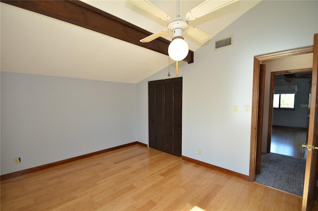 interior space with ceiling fan, light hardwood / wood-style floors, and lofted ceiling