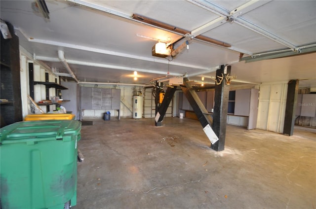 garage with electric water heater and a garage door opener