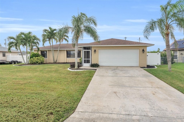 ranch-style house featuring a garage and a front lawn