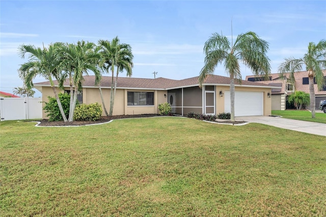 ranch-style house with a garage and a front lawn