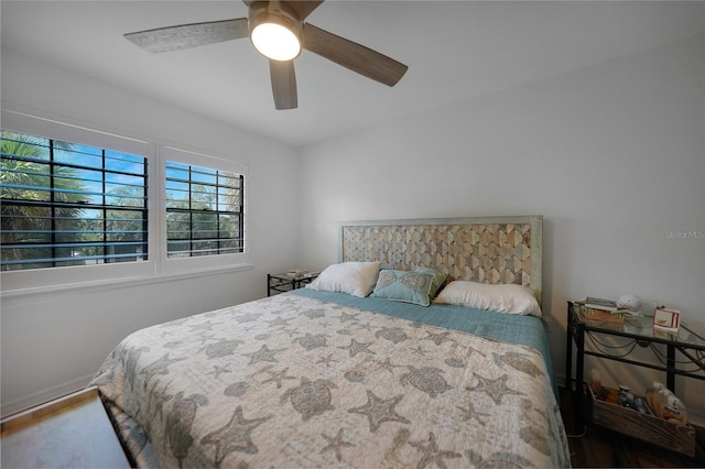 bedroom with wood-type flooring and ceiling fan