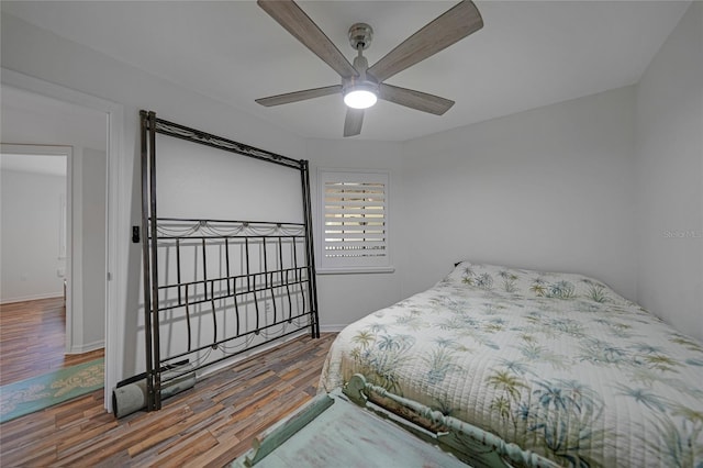 bedroom featuring wood-type flooring and ceiling fan