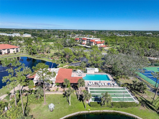 birds eye view of property with a water view