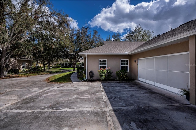 view of property exterior with a garage