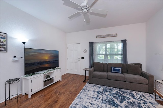 living room featuring dark hardwood / wood-style floors and ceiling fan