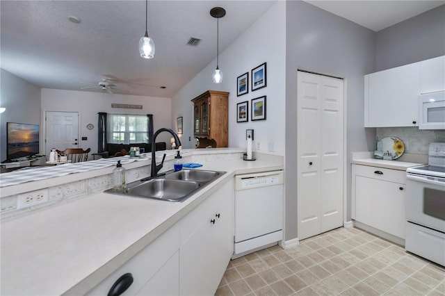 kitchen with white appliances, ceiling fan, sink, decorative light fixtures, and white cabinets