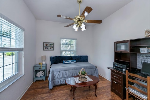 bedroom featuring ceiling fan and dark hardwood / wood-style floors