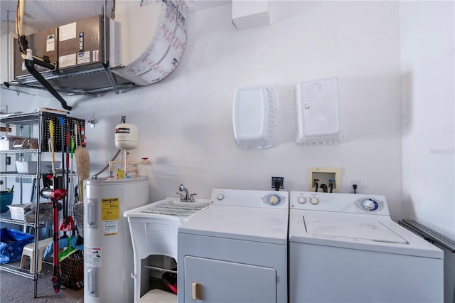 laundry room featuring carpet flooring, a textured ceiling, electric water heater, and washing machine and clothes dryer