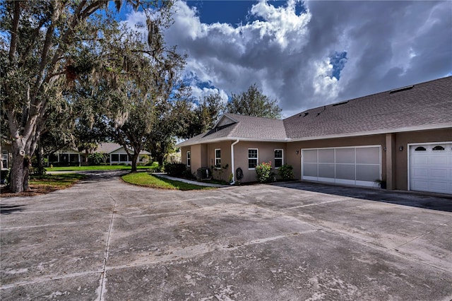 ranch-style home featuring a garage