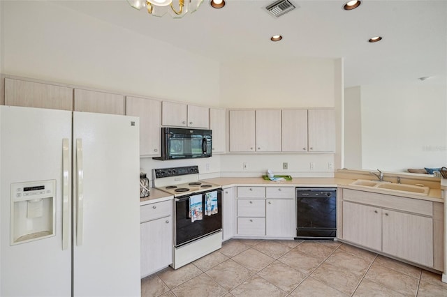 kitchen with black appliances, a notable chandelier, light tile patterned flooring, and sink