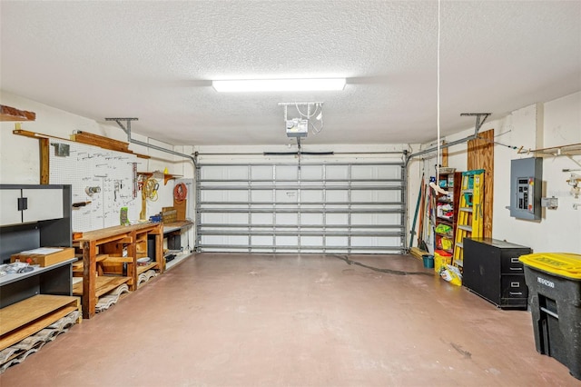 garage with a workshop area, electric panel, and a garage door opener