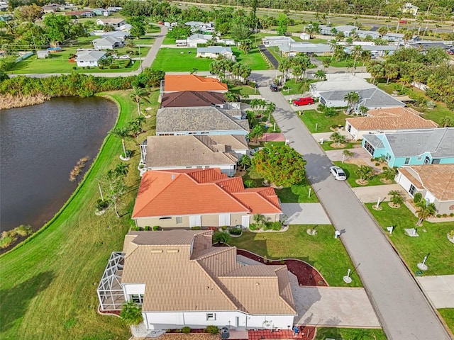 drone / aerial view with a water view