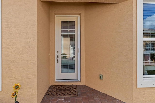 4410 Turnberry Cir, North Port, FL 34288 - doorway to property with stucco siding