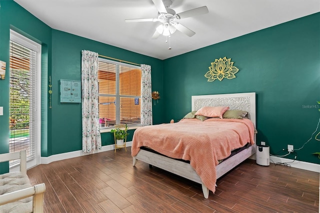 bedroom with ceiling fan and dark hardwood / wood-style floors