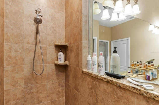 bathroom featuring tiled shower