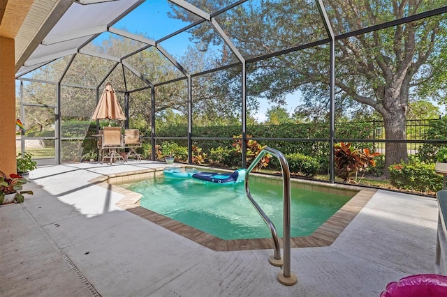 view of pool featuring a lanai, a patio, and a hot tub