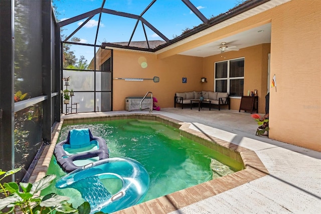 view of pool featuring outdoor lounge area, ceiling fan, a lanai, and a patio