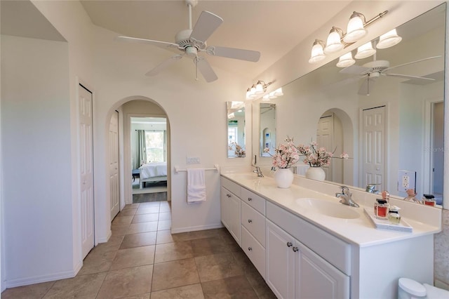 bathroom with tile patterned floors, ceiling fan, and vanity