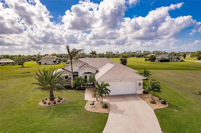 view of front of house featuring a garage and a front yard