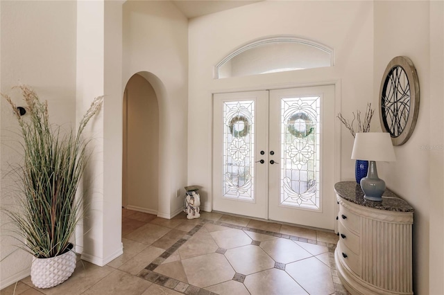 tiled foyer with french doors