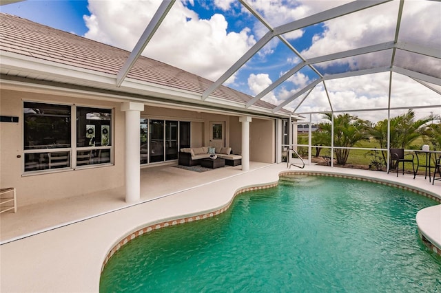 view of swimming pool with outdoor lounge area, glass enclosure, and a patio