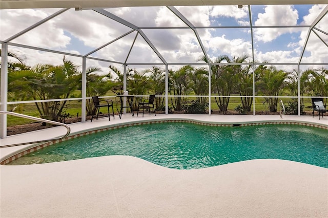 view of pool with a lanai and a patio area