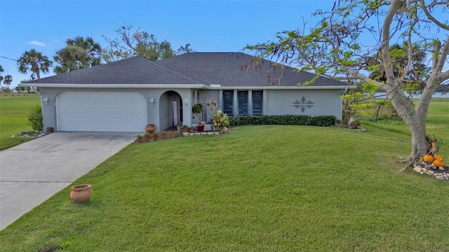 ranch-style home with a garage and a front lawn