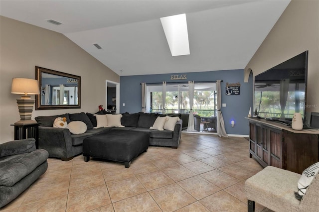 living room with light tile patterned floors and lofted ceiling