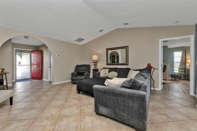 tiled living room with vaulted ceiling