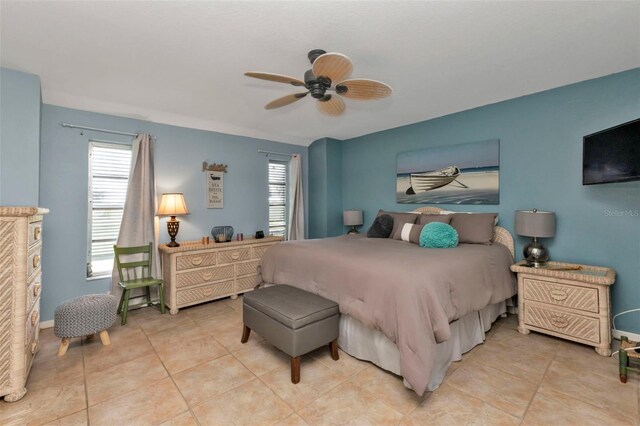 tiled bedroom with ceiling fan