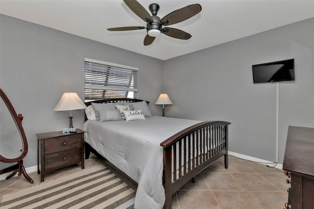 tiled bedroom featuring ceiling fan