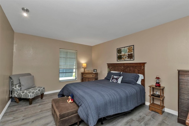 bedroom with light hardwood / wood-style flooring