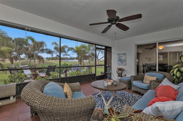 sunroom featuring ceiling fan