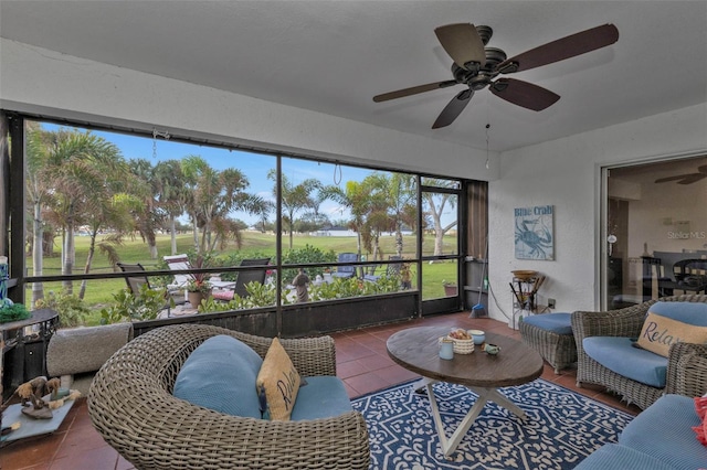 sunroom featuring ceiling fan