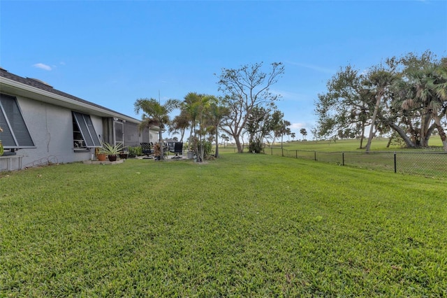 view of yard with a rural view