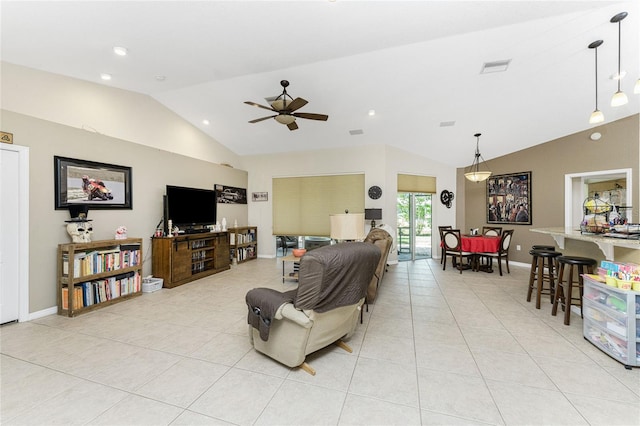 tiled living room with ceiling fan and vaulted ceiling