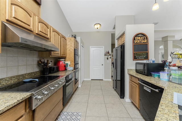 kitchen featuring light stone countertops, tasteful backsplash, lofted ceiling, light tile patterned floors, and black appliances