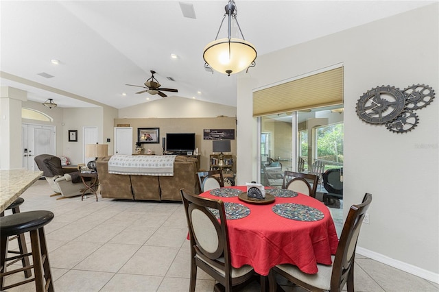 dining area with light tile patterned floors, vaulted ceiling, and ceiling fan