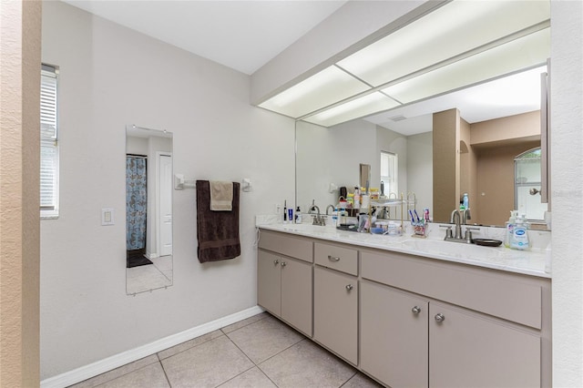 bathroom featuring tile patterned flooring and vanity