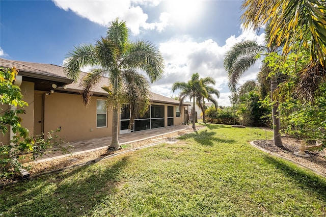 view of yard with a sunroom