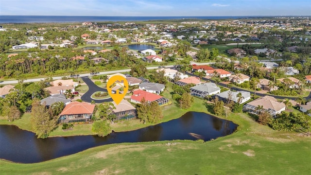 birds eye view of property featuring a water view