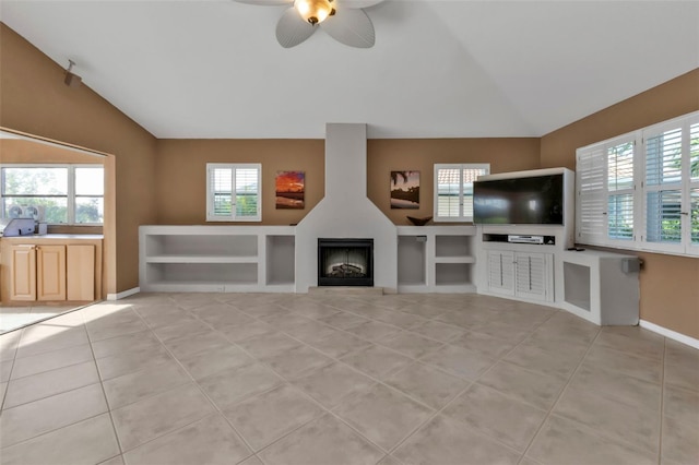 unfurnished living room featuring ceiling fan, light tile patterned flooring, and lofted ceiling