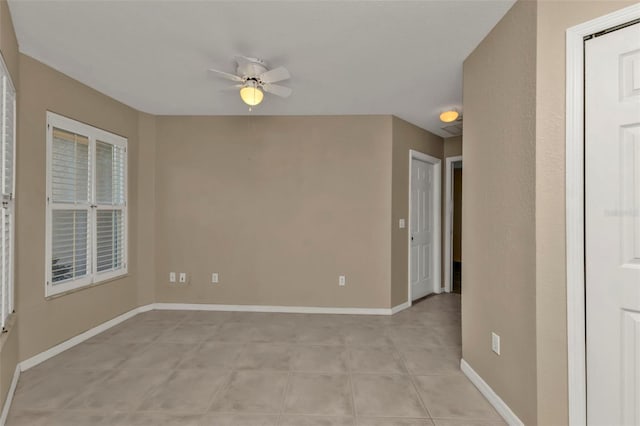 unfurnished room featuring ceiling fan