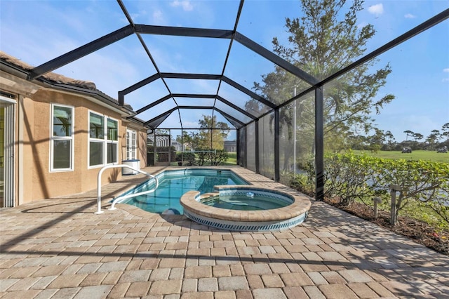 view of swimming pool with glass enclosure, a patio area, and an in ground hot tub