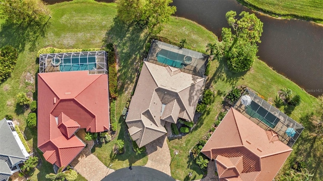 birds eye view of property featuring a water view