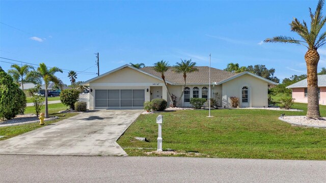 ranch-style home with a garage and a front lawn